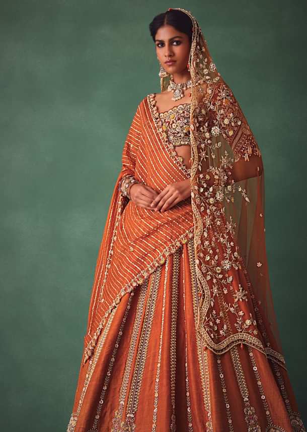 Rust Raw Silk Bridal Lehenga With Buti Work Dupatta