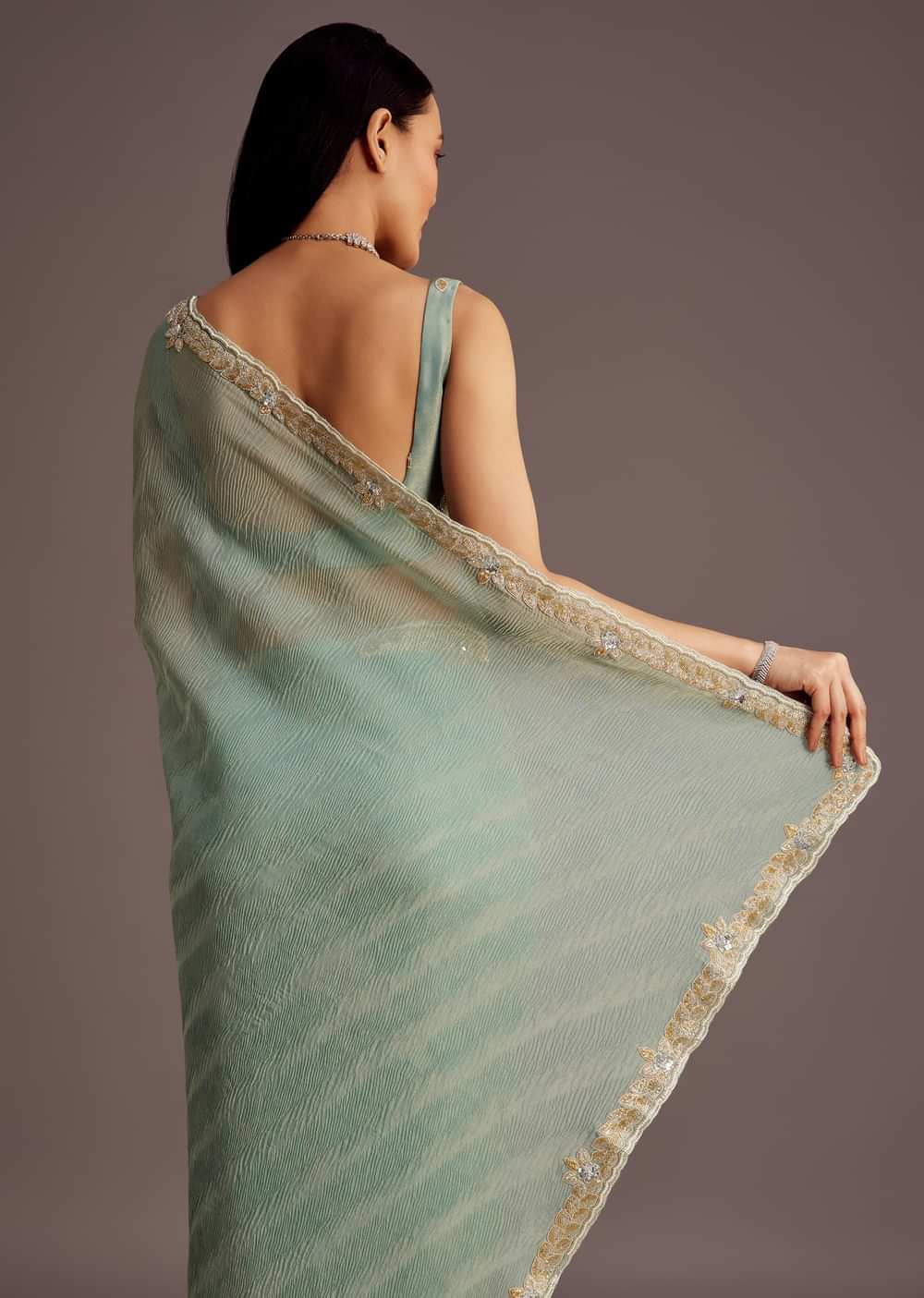 Turquoise Blue Crush Tissue Cutdana Work Saree With Embroidered Border