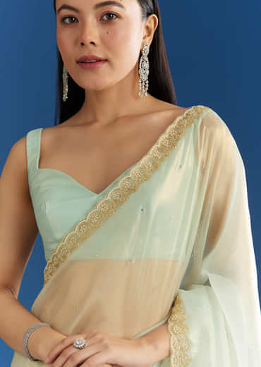 Aqua Blue Organza Tissue Embellishd Saree With Scallop Border