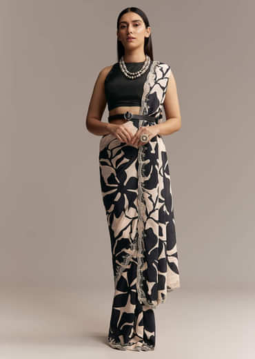 Beige Crepe Saree With Black Floral Print And Embellished Border