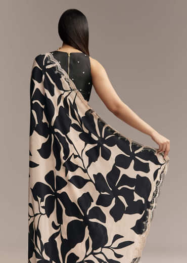 Beige Crepe Saree With Black Floral Print And Embellished Border