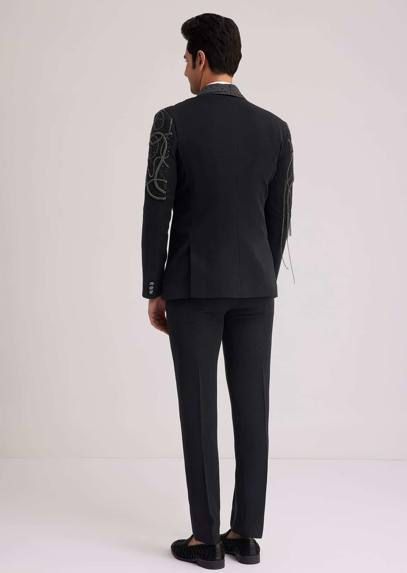 Black Suiting Tuxedo With Metallic Chain And Stone Work
