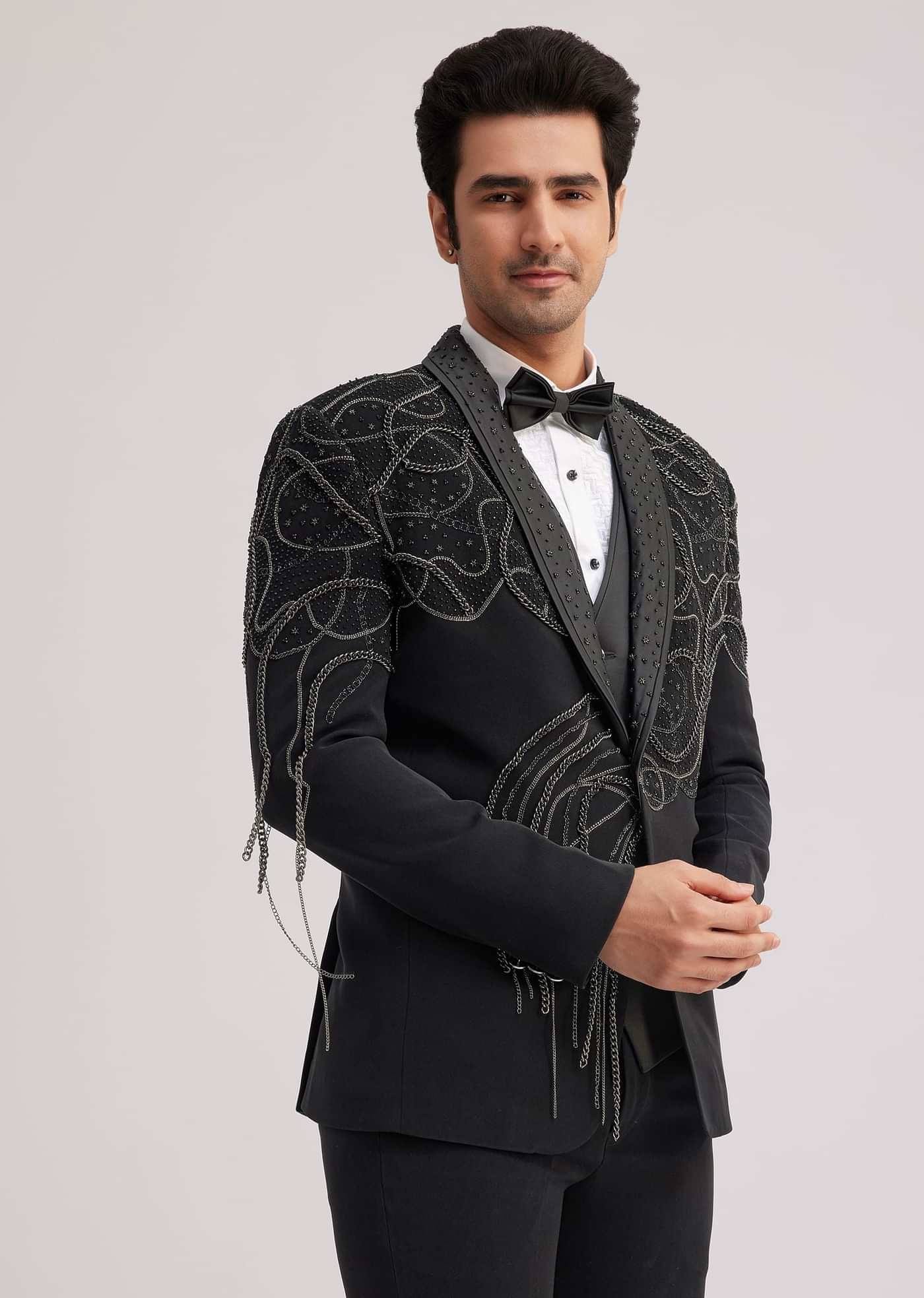 Black Suiting Tuxedo With Metallic Chain And Stone Work