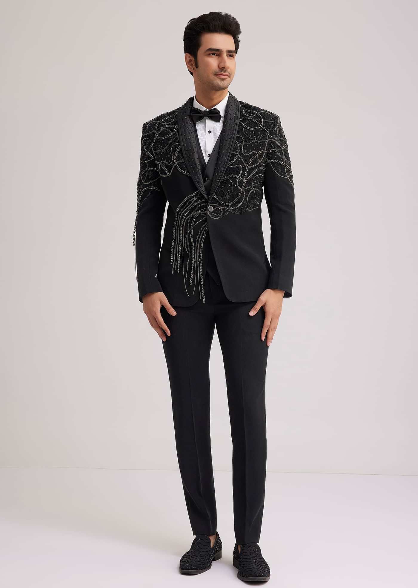 Black Suiting Tuxedo With Metallic Chain And Stone Work