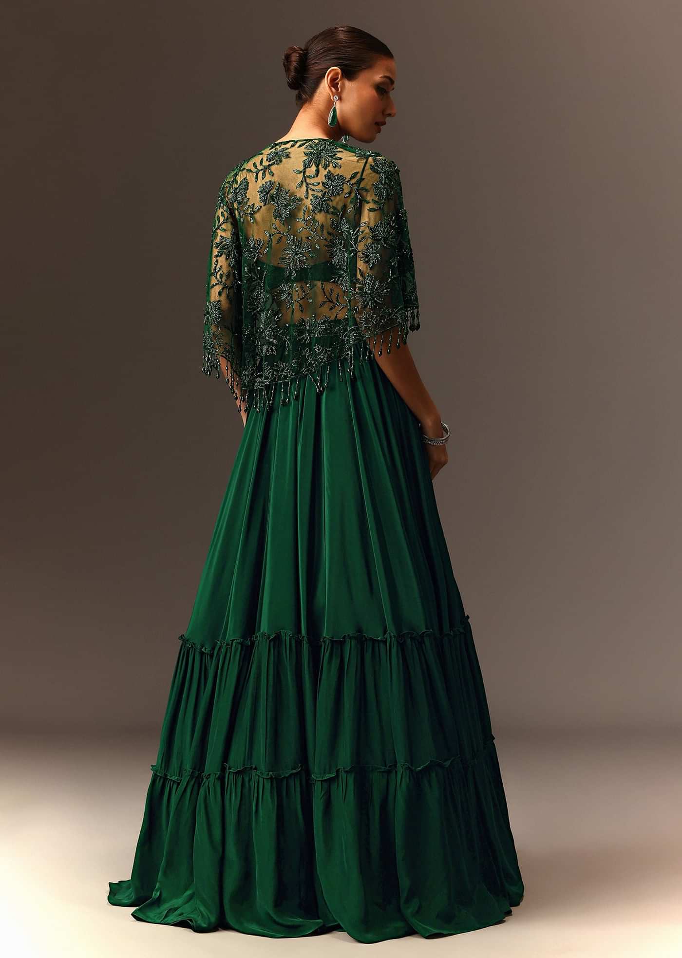 Bottle Green Tiered Lehenga With Net Cape