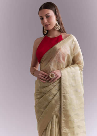 Cream Tissue Saree With Subtle Weave And Zari Border