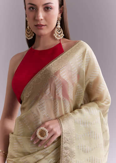 Cream Tissue Saree With Subtle Weave And Zari Border