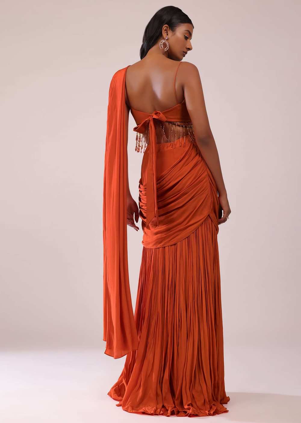 Orange Crepe Drape Saree And Blouse With Crystal Tassels All Over