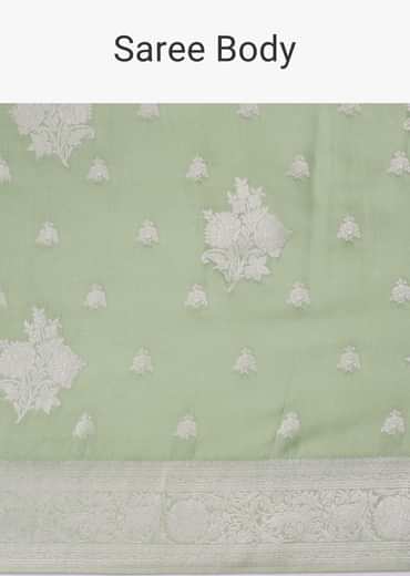 Forest shade green woven saree in Dola silk