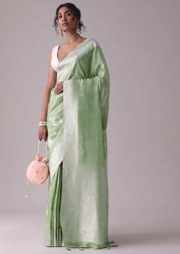 Forest shade green woven saree in Dola silk