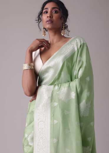 Forest shade green woven saree in Dola silk