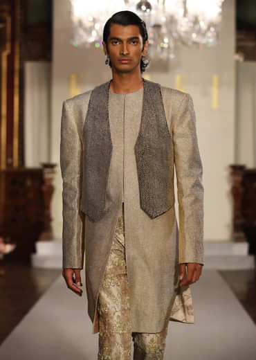 Gold Metallic Hand Embroidered Bridal Gown With Asymmetric Fall