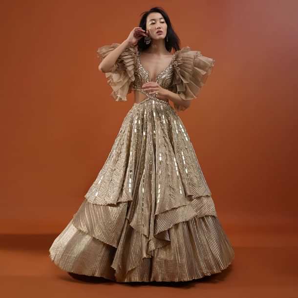 Gold Toned Kalki Gown With Ruffle Sleeves And Embroidery - NOOR 2022