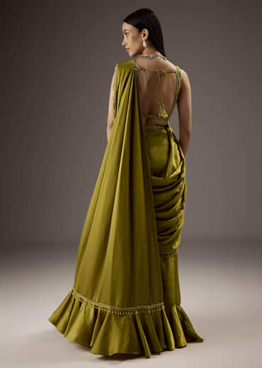 Green Silk Saree With Elegant Bead Work And Frills