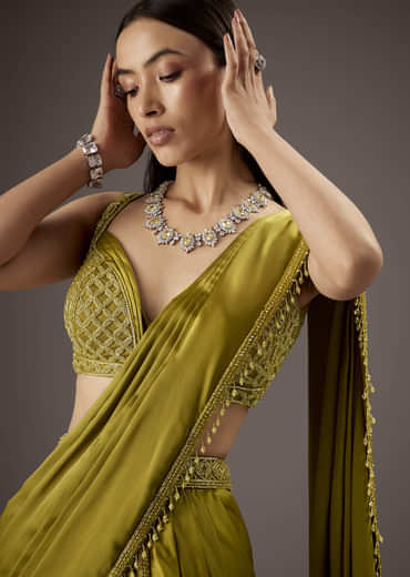 Green Silk Saree With Elegant Bead Work And Frills