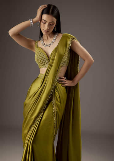 Green Silk Saree With Elegant Bead Work And Frills