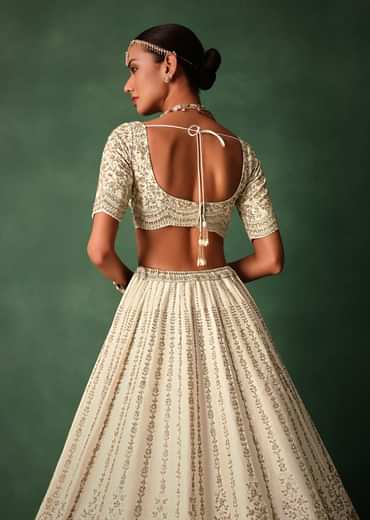 Ivory Raw Silk Hand Embroidered Lehenga Set In Cutdana Work