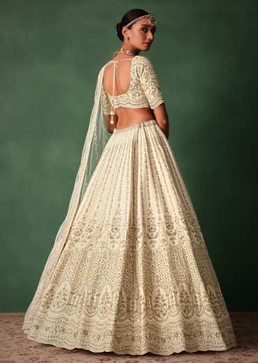 Ivory Raw Silk Hand Embroidered Lehenga Set In Cutdana Work
