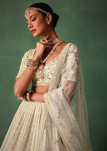 Ivory Raw Silk Hand Embroidered Lehenga Set In Cutdana Work