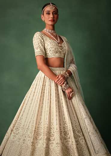 Ivory Raw Silk Hand Embroidered Lehenga Set In Cutdana Work