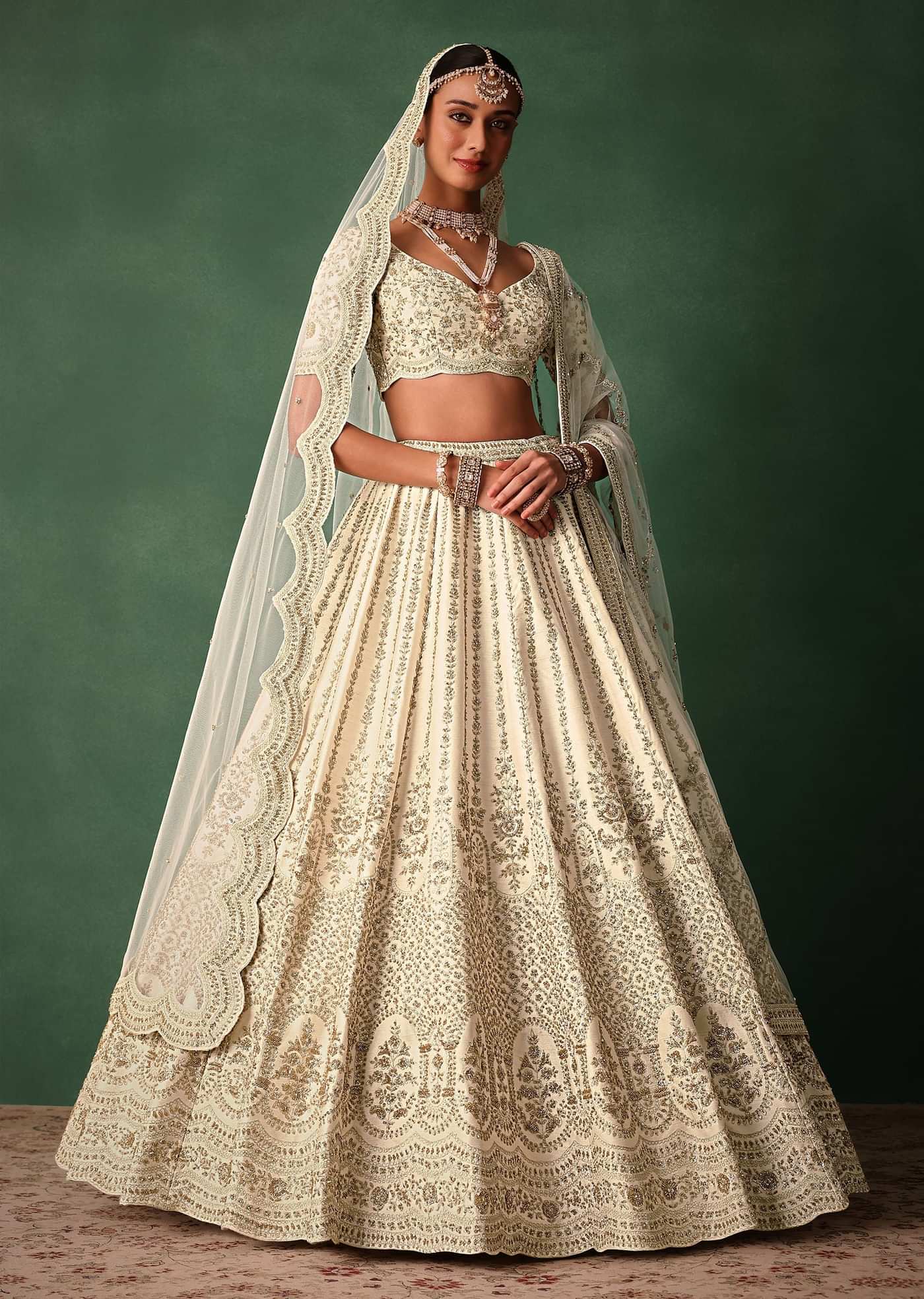 Ivory Raw Silk Hand Embroidered Lehenga Set In Cutdana Work