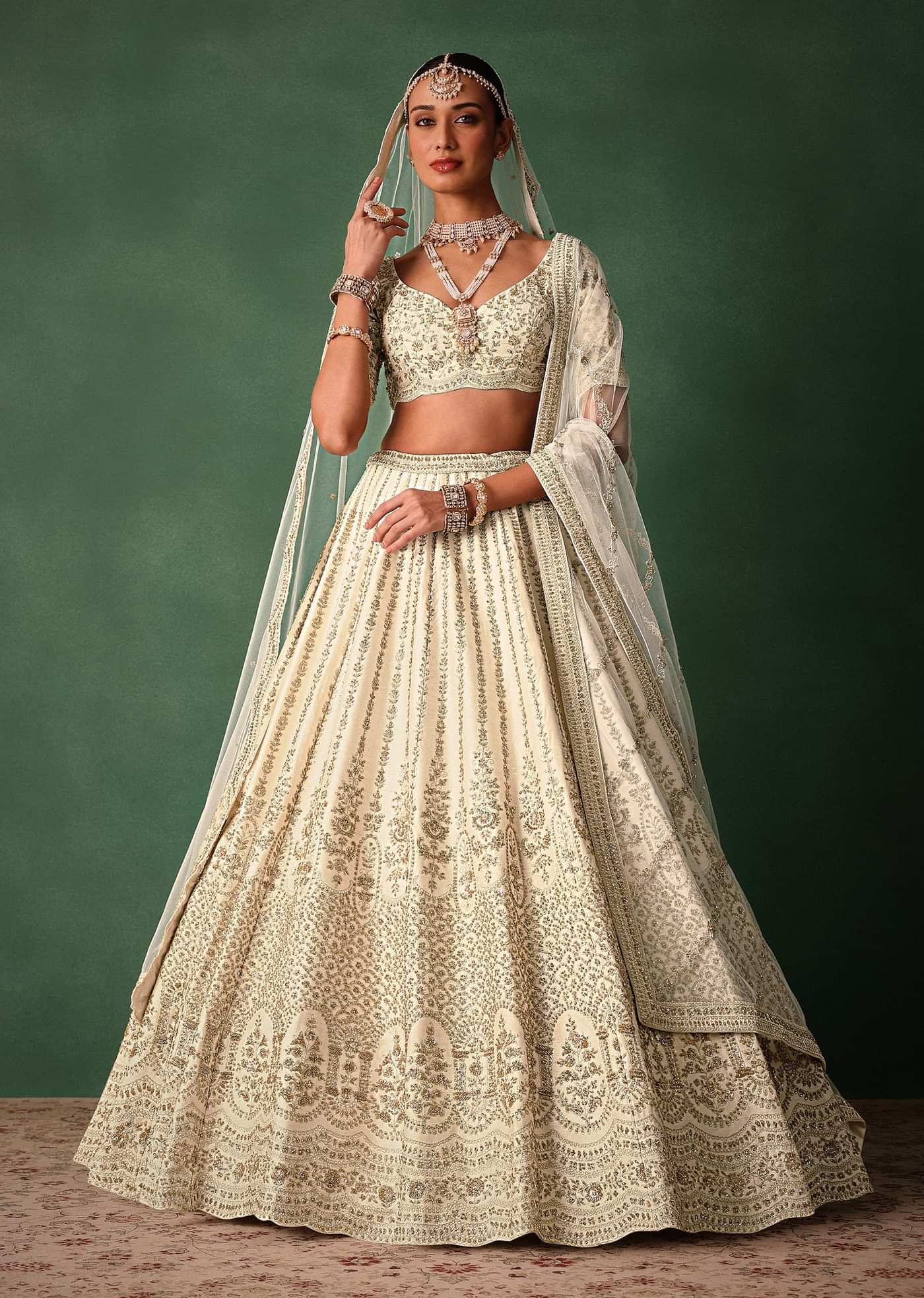 Ivory Raw Silk Hand Embroidered Lehenga Set In Cutdana Work