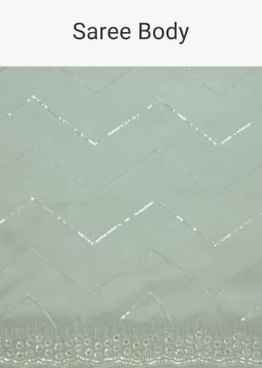 Light Blue Glass Tissue Saree With Stone Embroidery And Scallop Border
