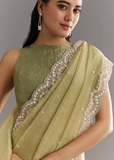Light Green Glossy Crushed Tissue Saree With Cutdana Sequins Embroidery And Scallop Border