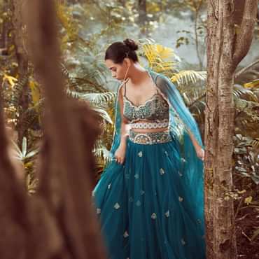 Nighttime Blue Lehenga In Net With Cut Dana And Sequins Embroidered Choli Designed With A Front Cut Out Online - Kalki Fashion