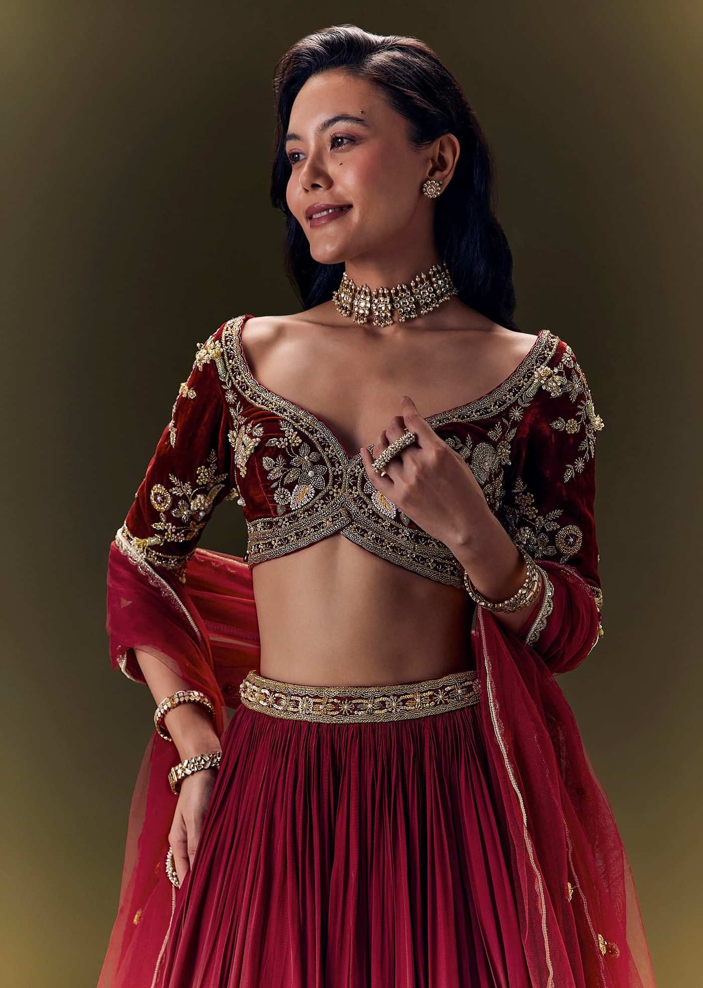 Maroon Pleated Skirt With Hand Embroidered Velvet Belt And Blouse With Net Dupatta