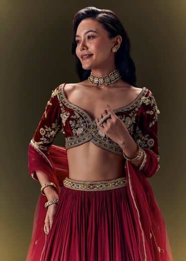 Maroon Pleated Skirt With Hand Embroidered Velvet Belt And Blouse With Net Dupatta