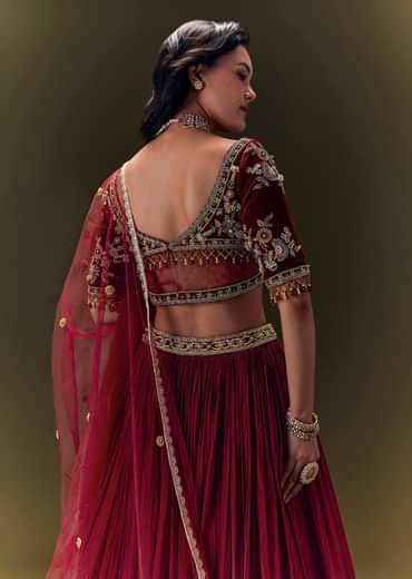 Maroon Pleated Skirt With Hand Embroidered Velvet Belt And Blouse With Net Dupatta