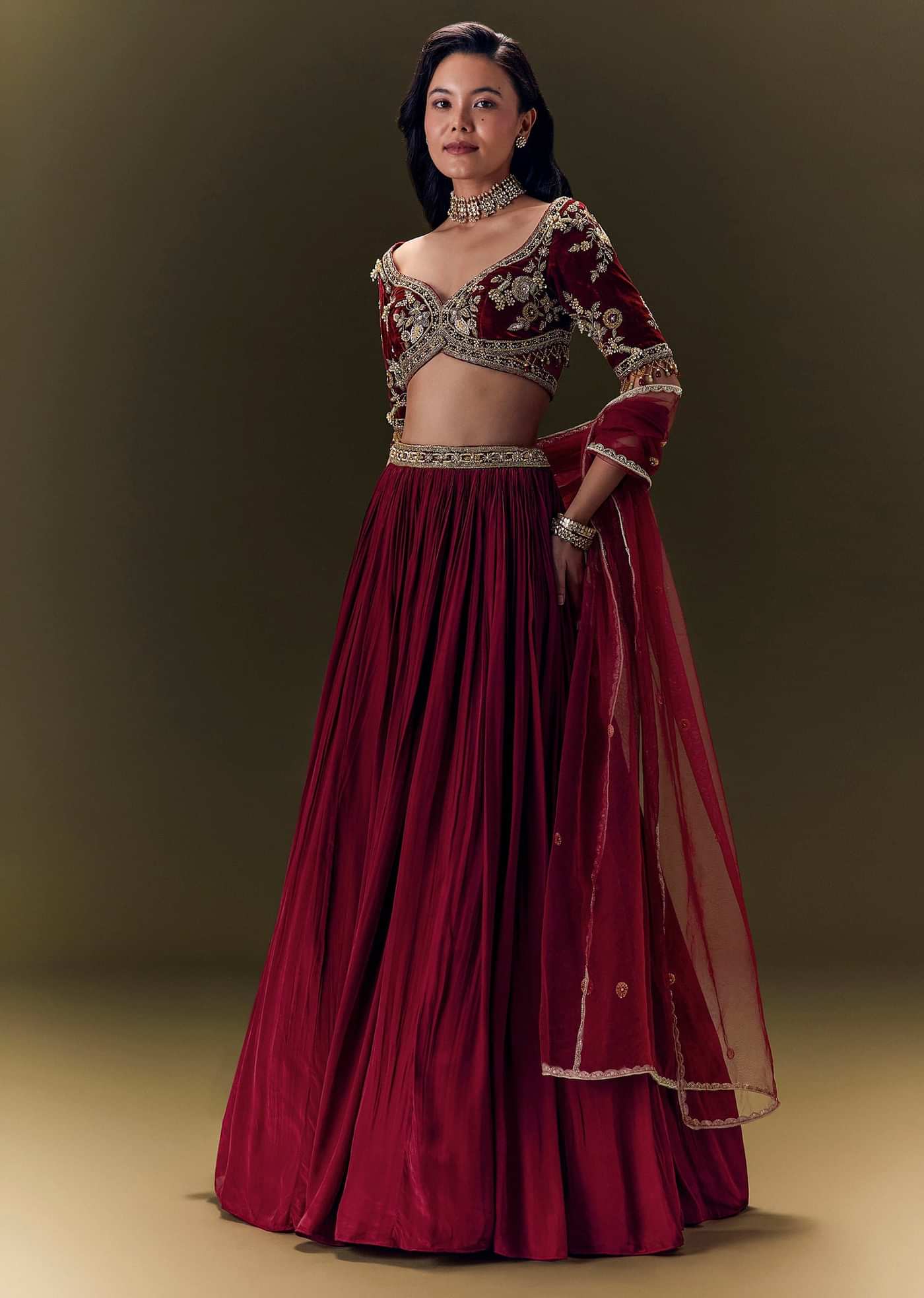 Maroon Pleated Skirt With Hand Embroidered Velvet Belt And Blouse With Net Dupatta
