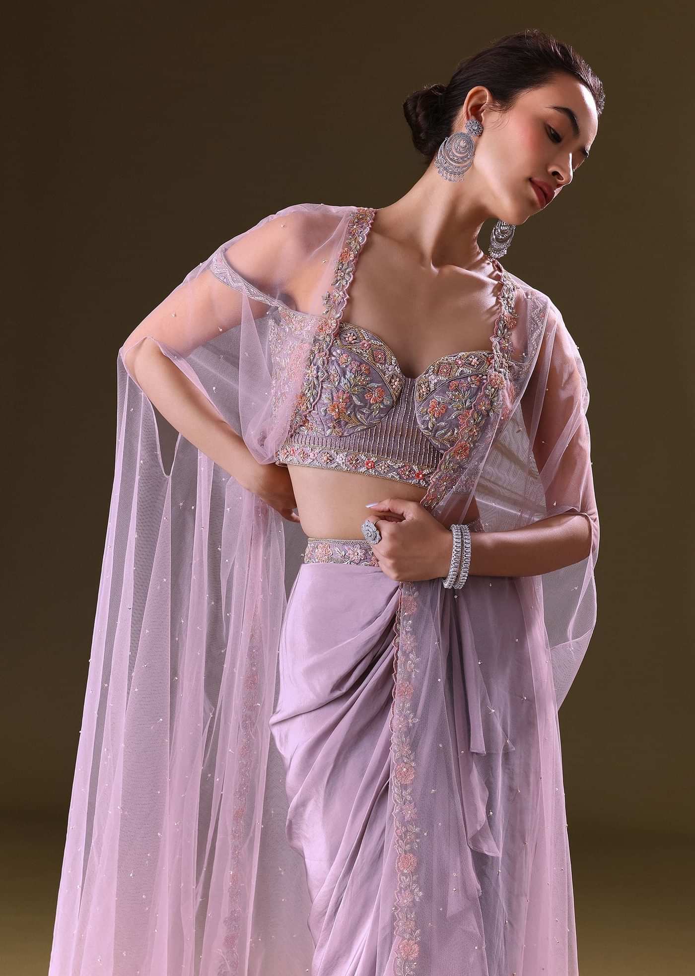 Mauve Ruffled Drape Skirt With Embroidered Blouse And Net Cape