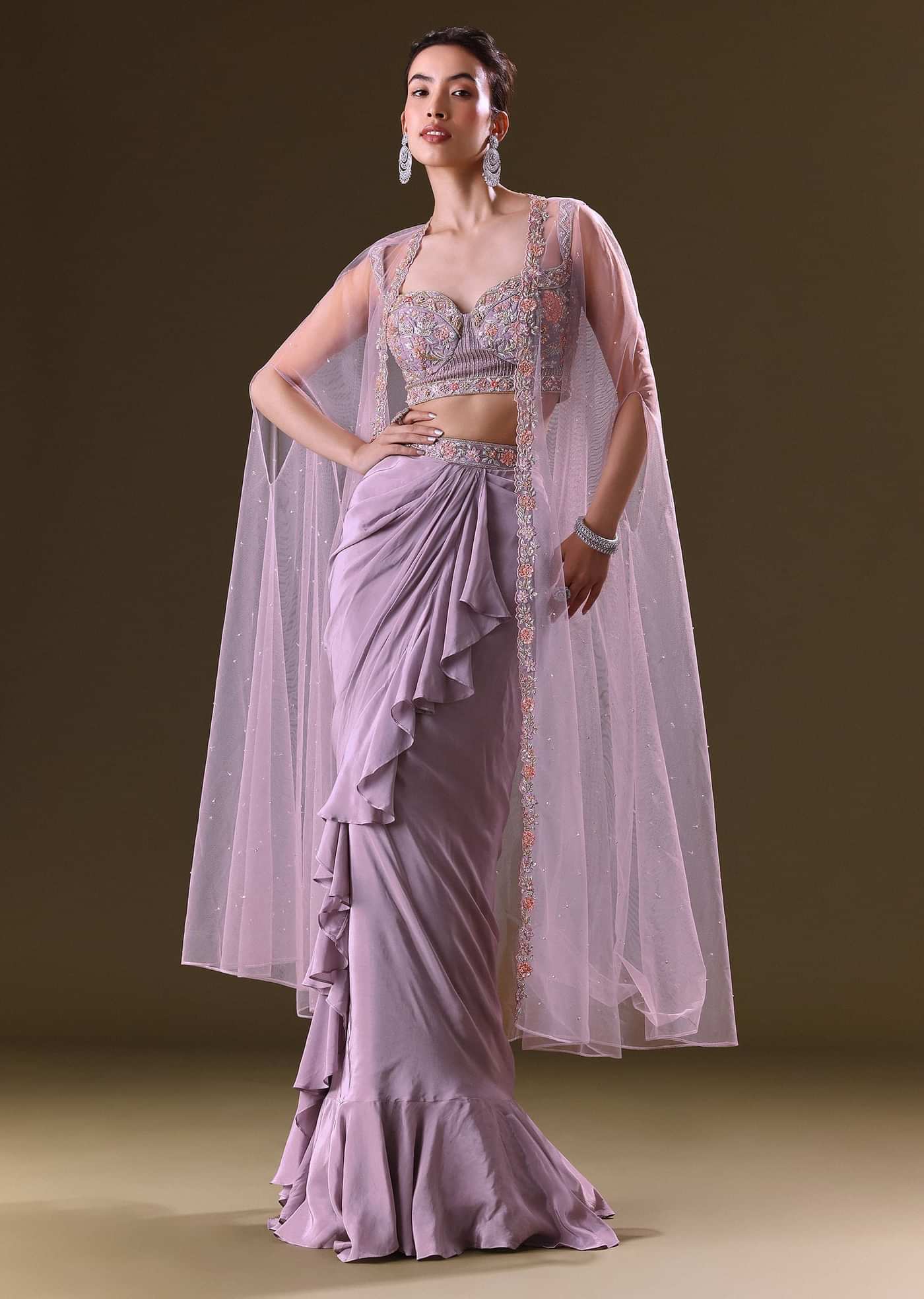 Mauve Ruffled Drape Skirt With Embroidered Blouse And Net Cape