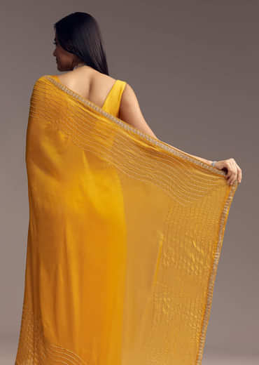 Mustard Yellow Organza Saree With Scallop Border And Stone Work