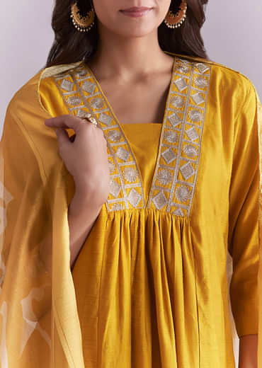 Mustard Yellow Silk Anarkali Suit With Zari Work And Floral Print Dupatta
