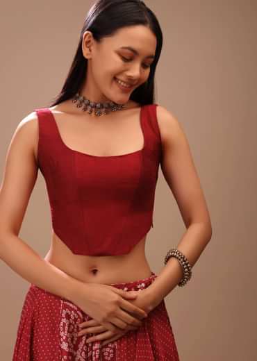 Maroon Corset Blouse In Raw Silk With Scooped Neckline And Tapered High Low Hem