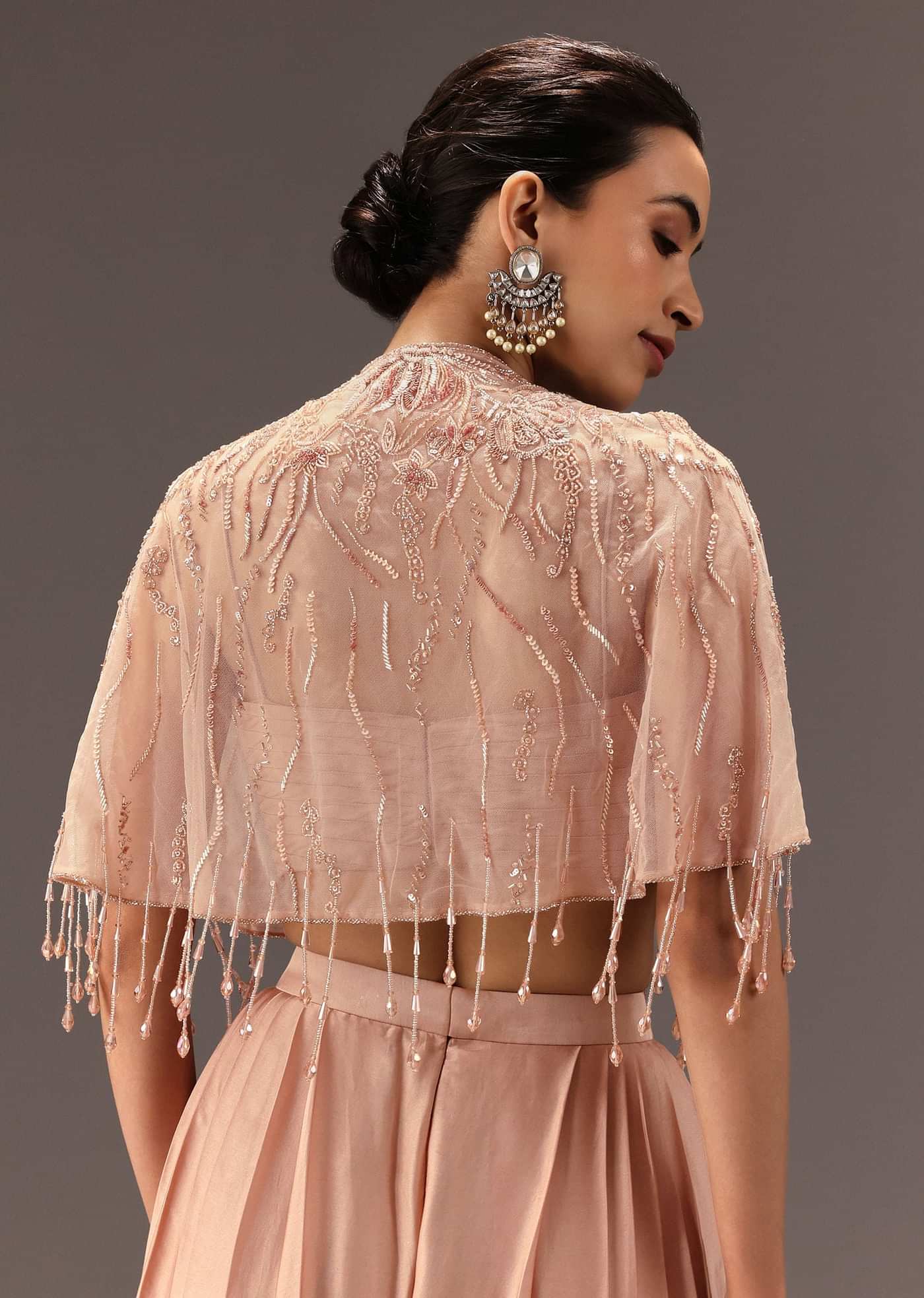 Nude Pleated Blouse With Tassel Cape And Dhoti Pants