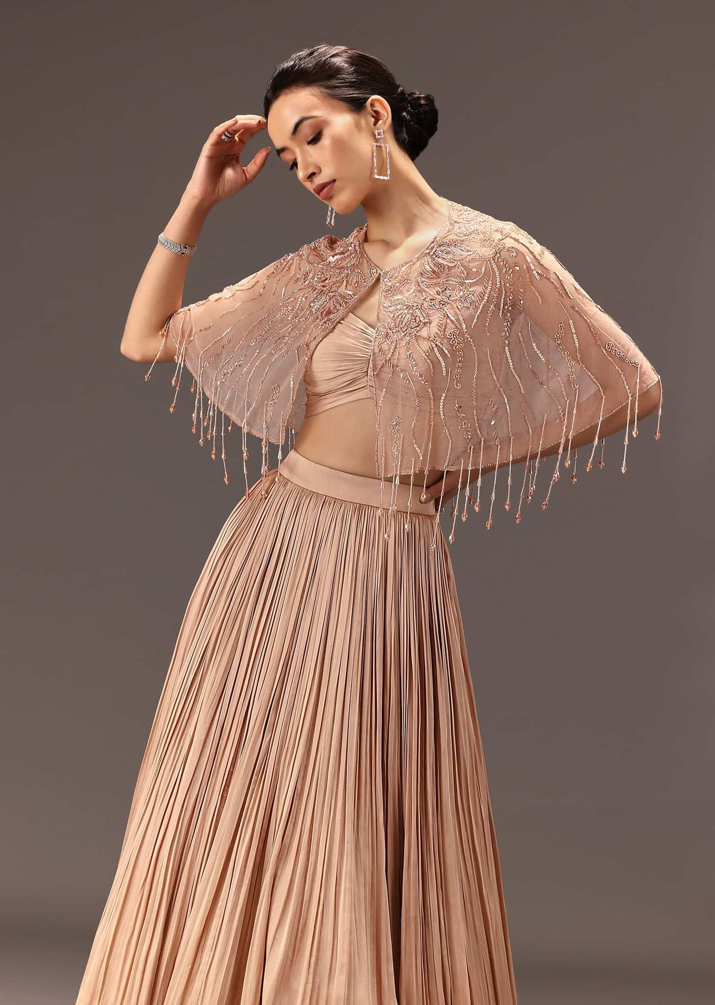 nude Ruched Blouse With Cape And Layered Skirt