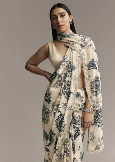 Off White Crepe Saree With Black Floral Print And Embroidered Border