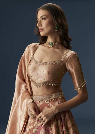 Orange Embroidered Blouse With Ruching Lehenga And Tassel Dupatta