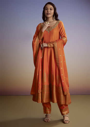 Orange Silk Anarkali Suit With Heavy Embroidery And Weave Border