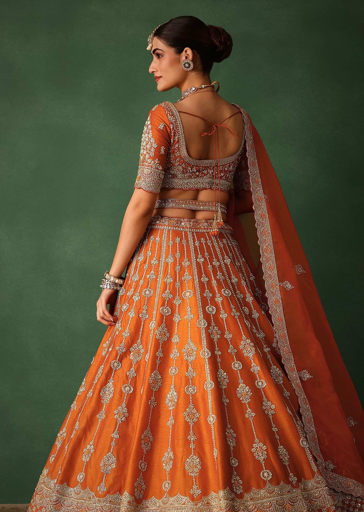 Orange Lehenga Set In Raw Silk With Hand Embroidered Motifs