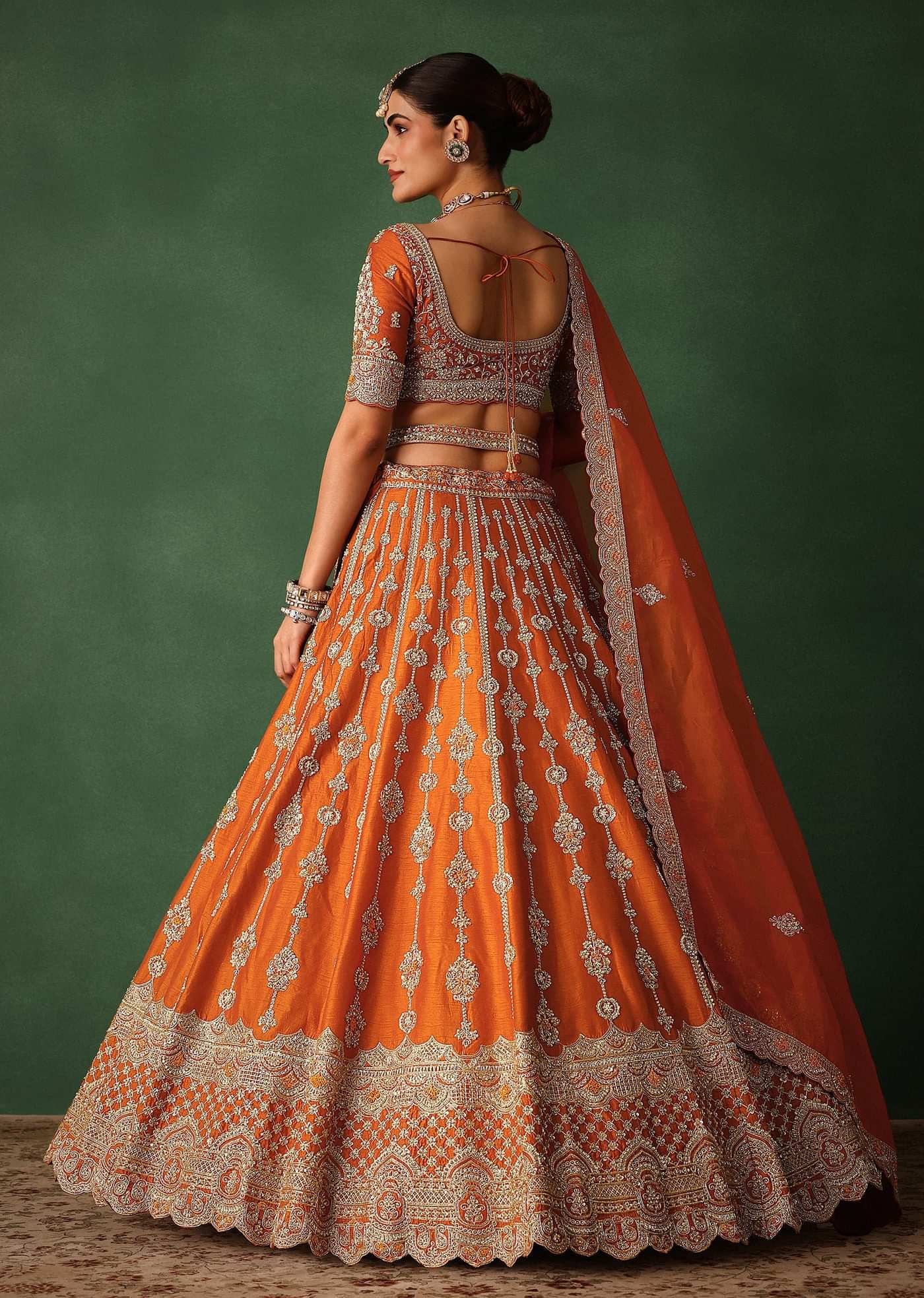 Orange Lehenga Set In Raw Silk With Hand Embroidered Motifs