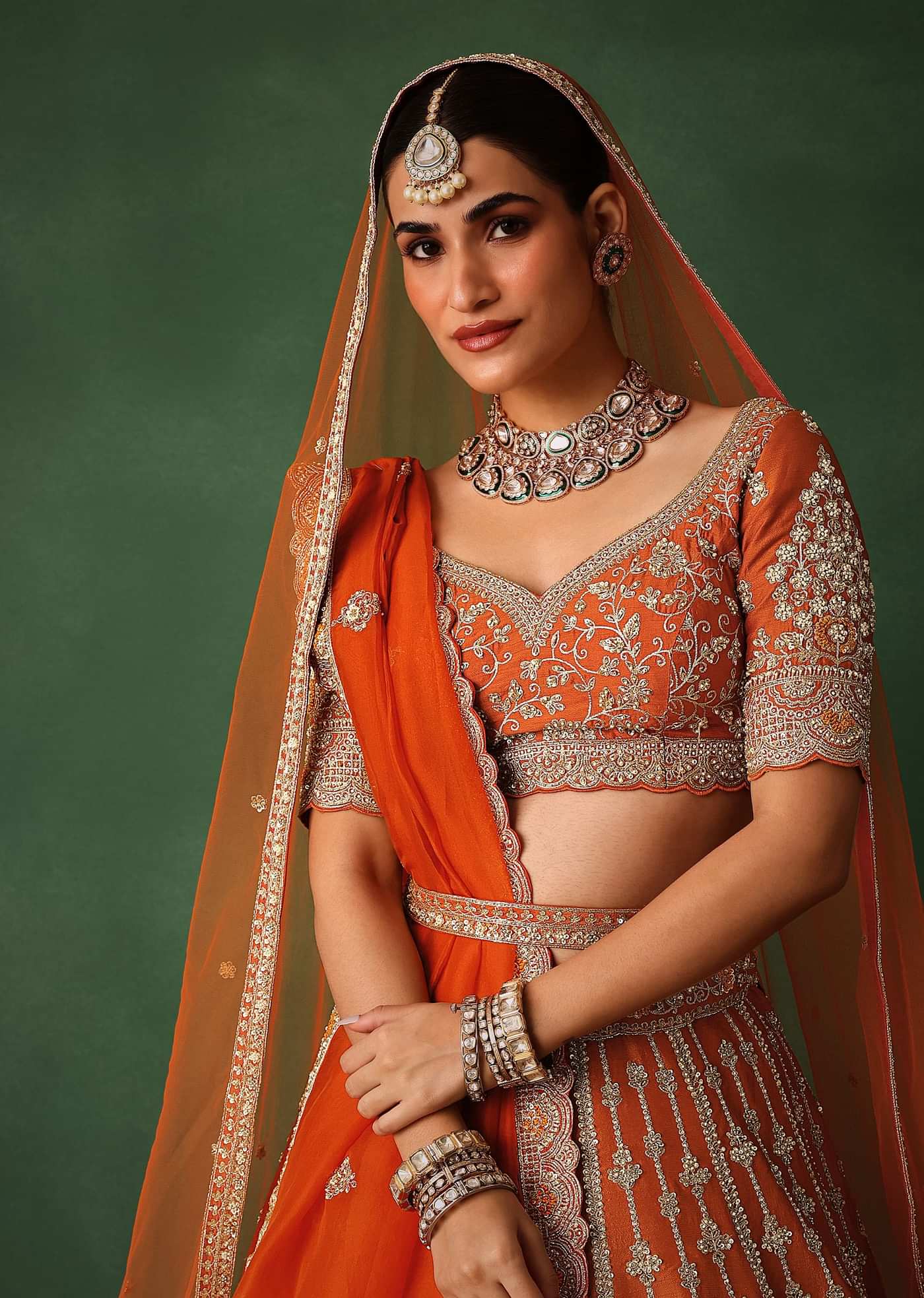 Orange Lehenga Set In Raw Silk With Hand Embroidered Motifs