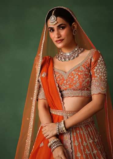 Orange Lehenga Set In Raw Silk With Hand Embroidered Motifs