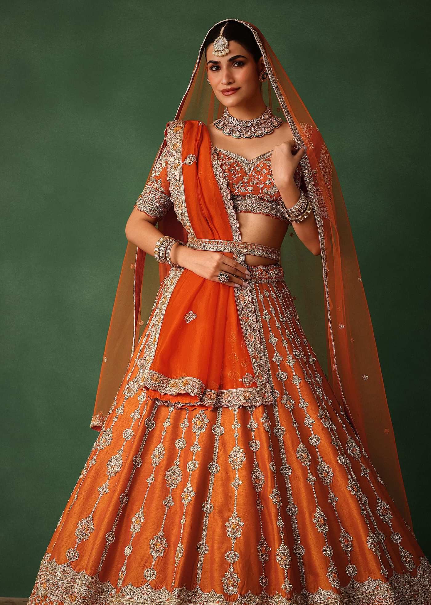 Orange Lehenga Set In Raw Silk With Hand Embroidered Motifs