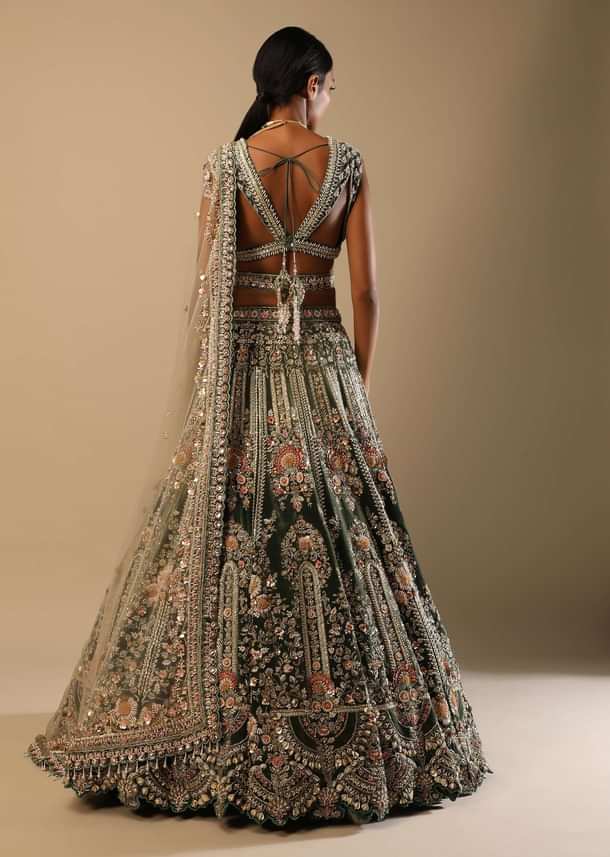 Palace Green Lehenga Choli In Velvet With Multi Colored Hand Embroidered Heritage Kalis With Hints Of Flowers