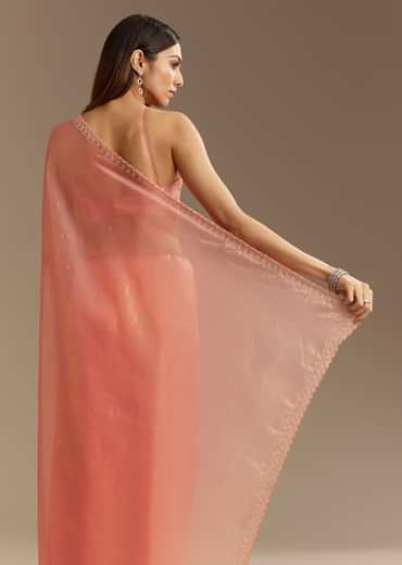 Peach Tissue Saree With Stones Cutdana Embellishments And Scallop Border